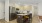 a kitchen with a table and chairs