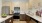 a kitchen with wooden cabinets
