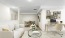 a living room with a white couch and a table