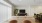 a living room with a couch and a piano