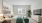 a bedroom with a tv and couch